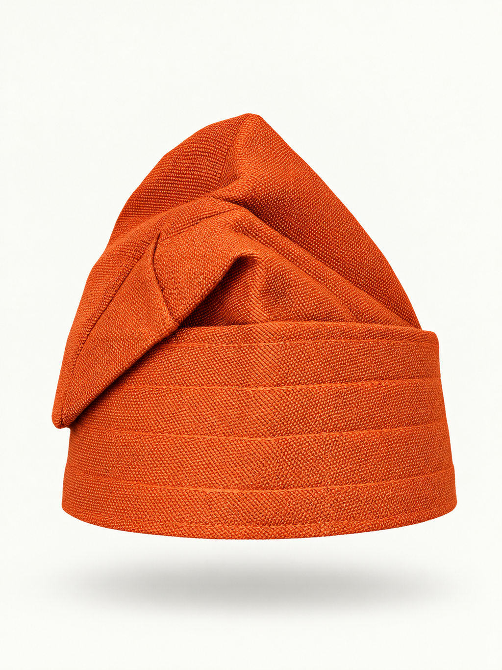 Orange handmade Yoruba Fìlà cap on display