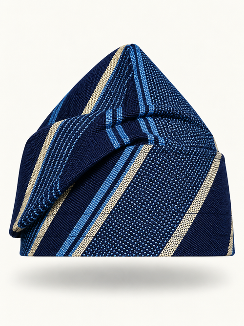 Blue handmade Yoruba Fìlà cap on display