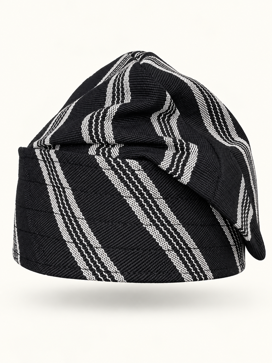 Black handmade Yoruba Fìlà cap on display