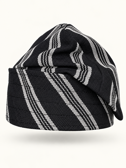 Black handmade Yoruba Fìlà cap on display