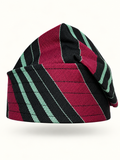 Multicoloured handmade Yoruba Fìlà cap on display