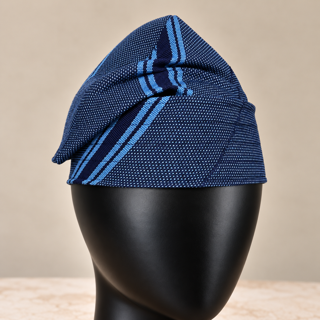 Blue handmade Yoruba Fìlà cap, angled view