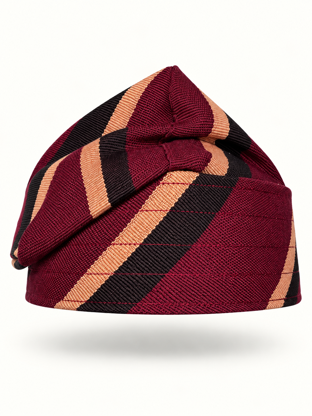 Red handmade Yoruba Fìlà cap on display