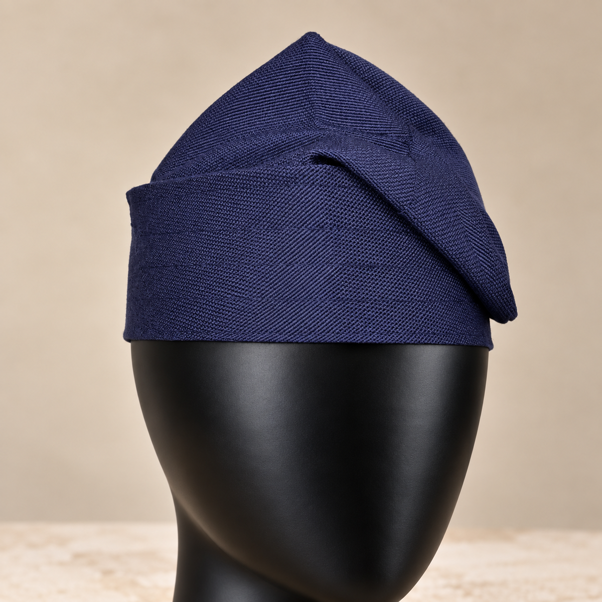 Navy Blue handmade Yoruba Fìlà cap, angled view