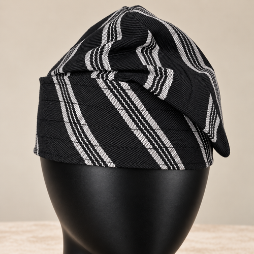 Black handmade Yoruba Fìlà cap, angled view