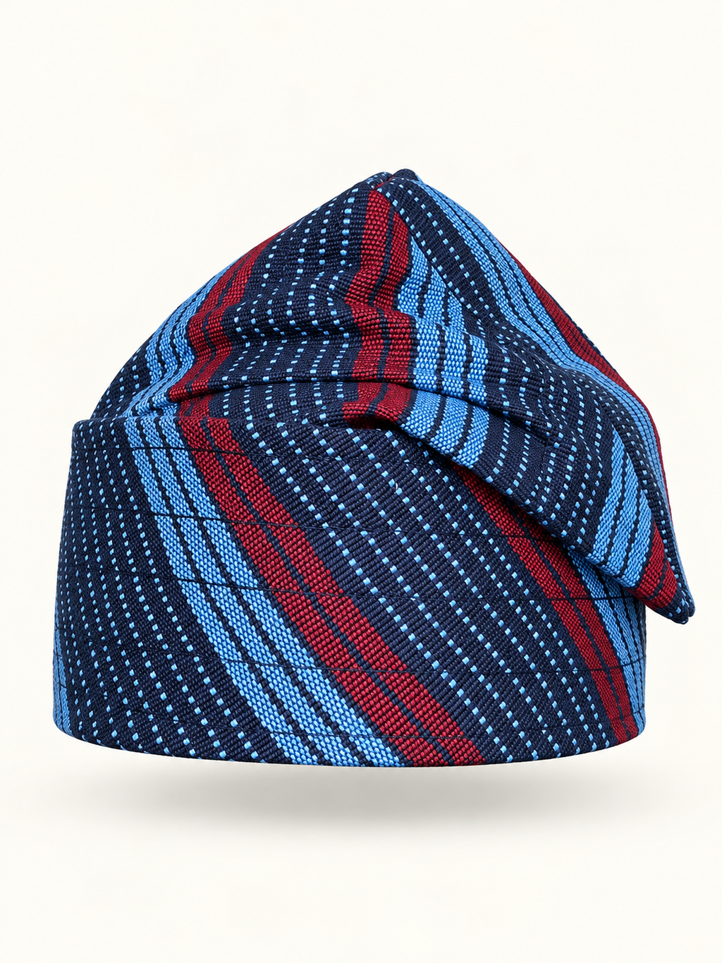 Blue handmade Yoruba Fìlà cap on display