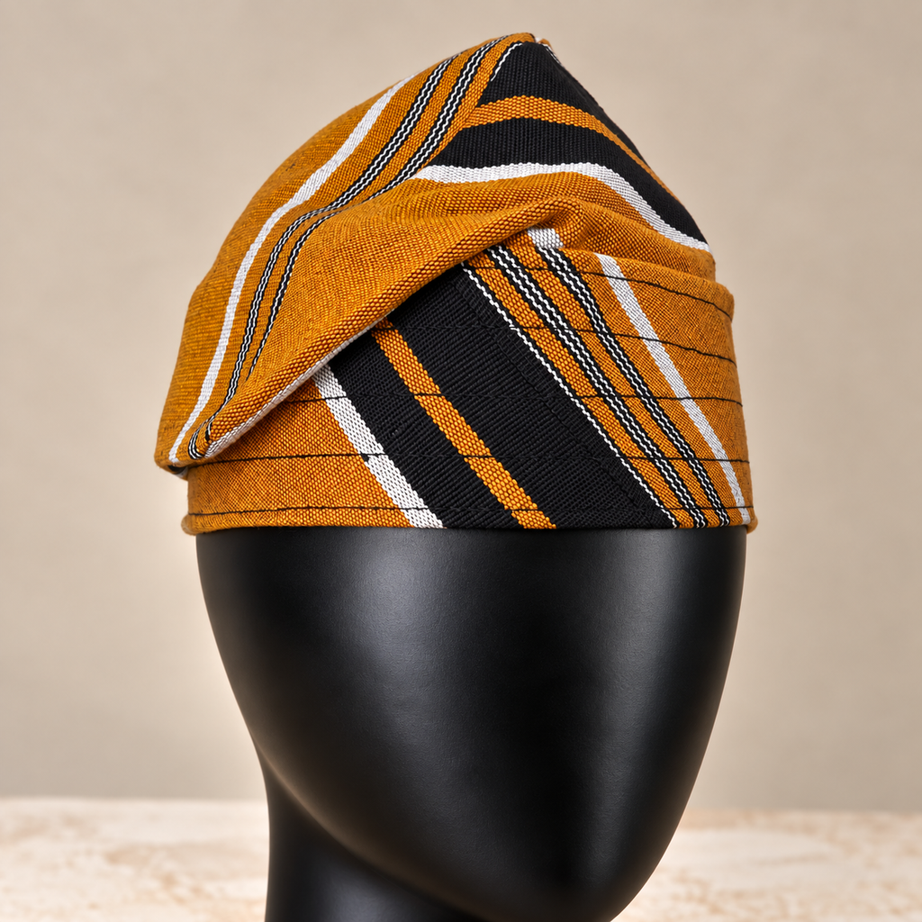 Yellow handmade Yoruba Fìlà cap, angled view
