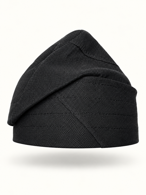 Black handmade Yoruba Fìlà cap on display