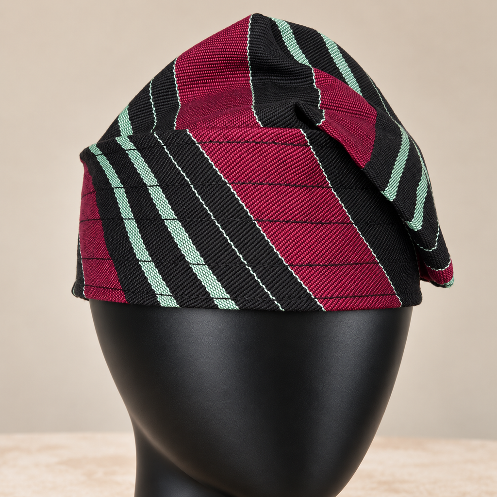 Multicoloured handmade Yoruba Fìlà cap, angled view