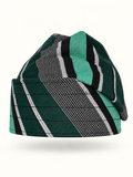 Green handmade Yoruba Fìlà cap on display