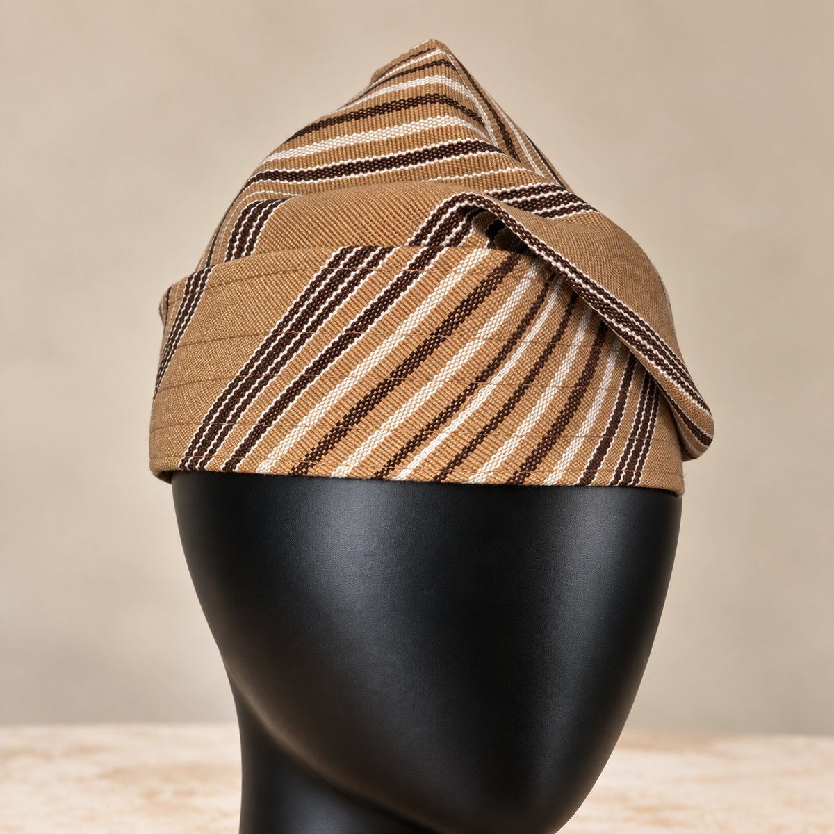 Gold handmade Yoruba Fìlà cap, angled view