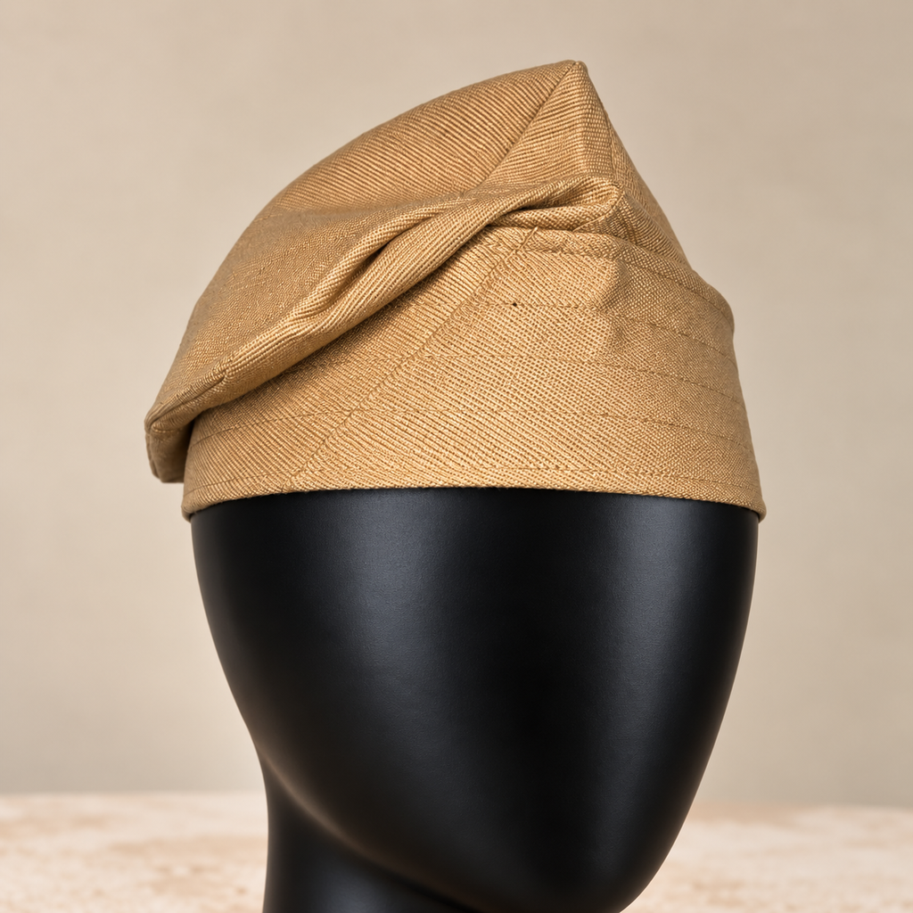 Gold handmade Yoruba Fìlà cap, angled view