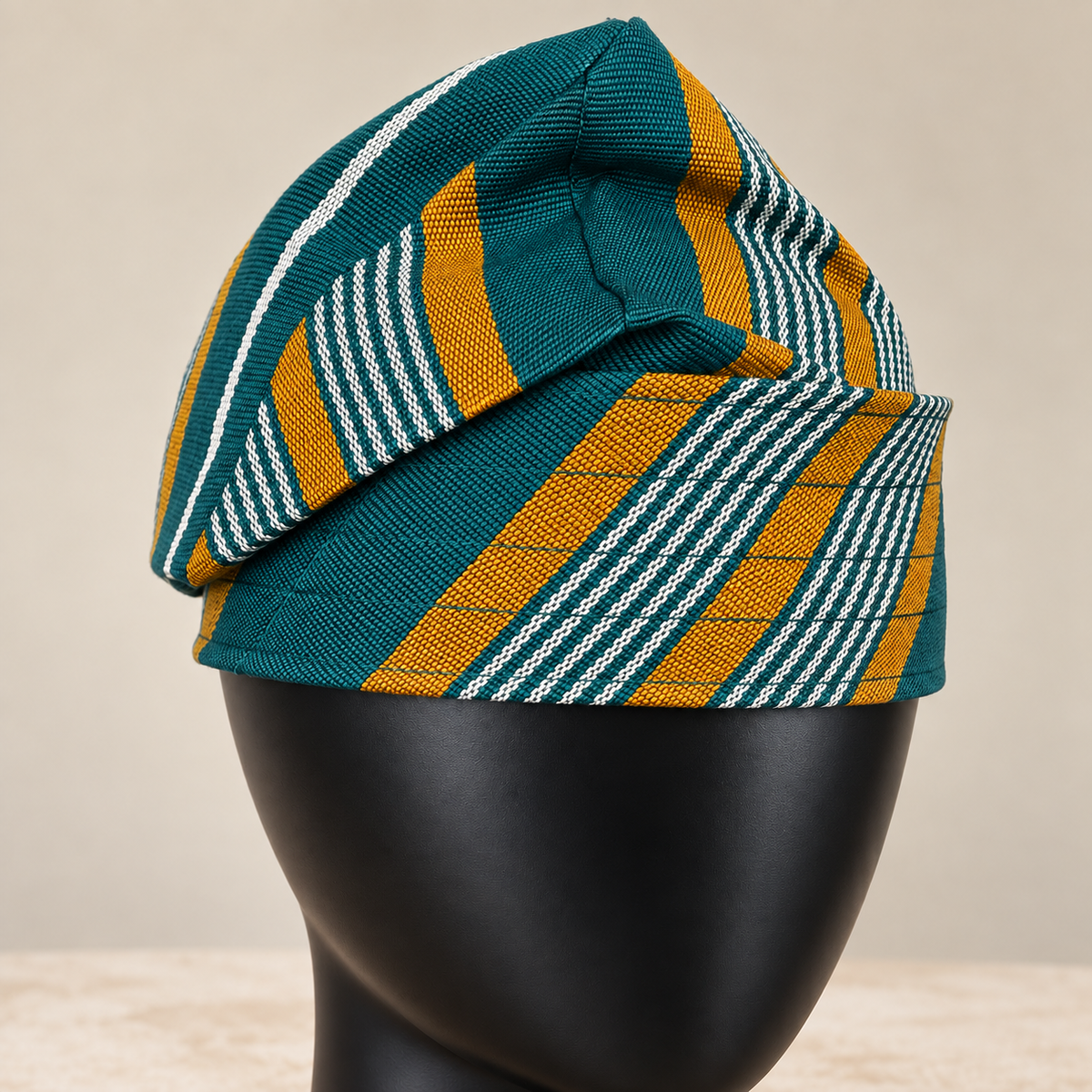 Multicoloured handmade Yoruba Fìlà cap, angled view