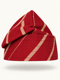Red handmade Yoruba Fìlà cap on display